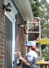 Trish and Murph painting trim